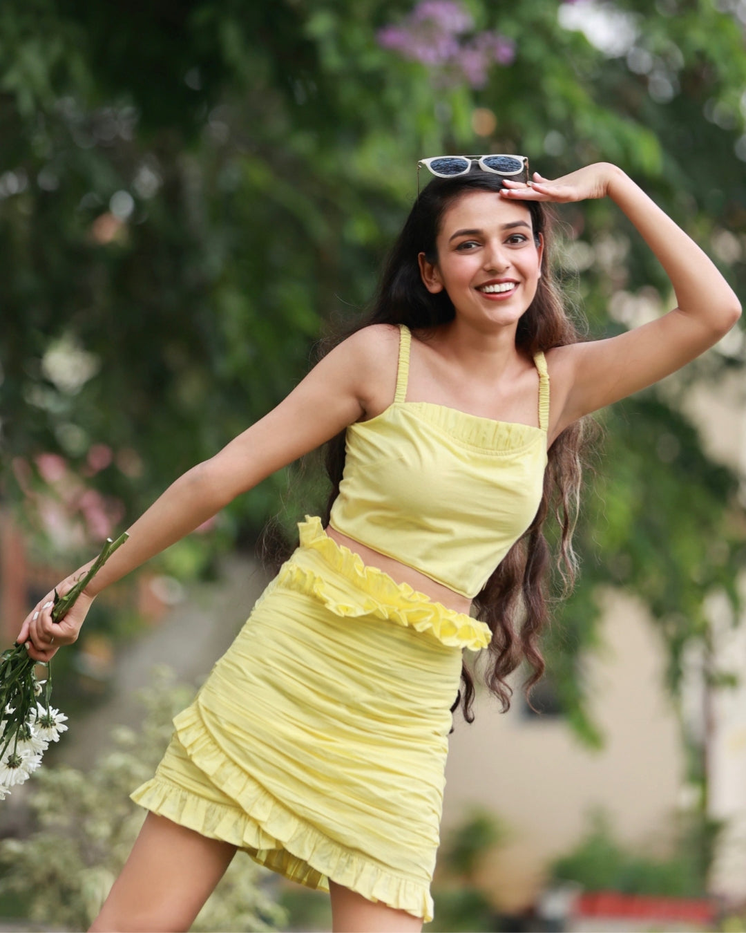 Warm yellow strappy top with delicate straps paired with a matching skirt, creating a chic and versatile co-ord set for any occasion.
