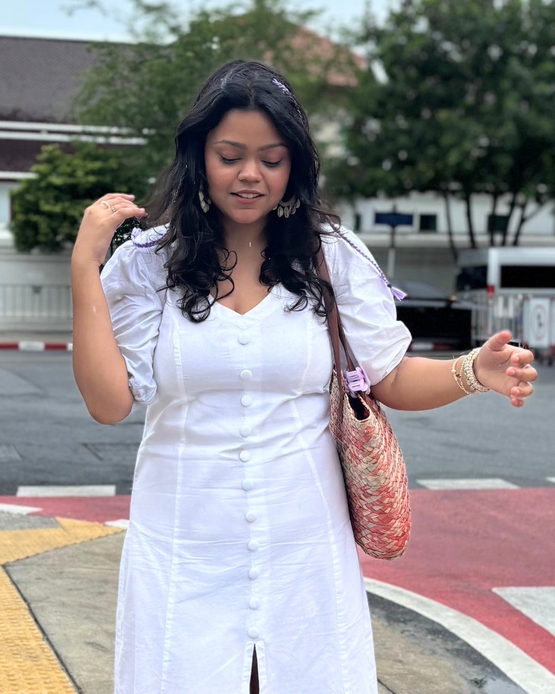 Elegant white Alyssa Button Down Maxi Dress in soft cotton with a V-neckline, button-down front, and front slit, featuring a flattering A-line silhouette.