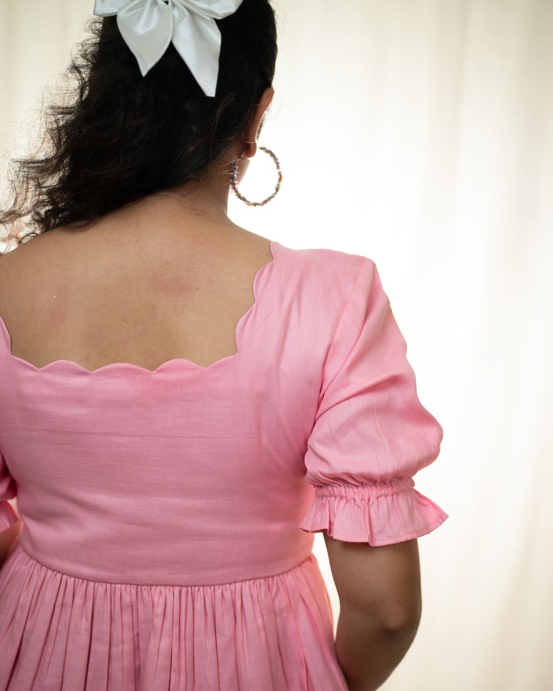 
Soft pink dress with a scallop neckline, fit and flare silhouette, made from breathable cotton. Perfect for casual outings, sunny days, and brunch dates.