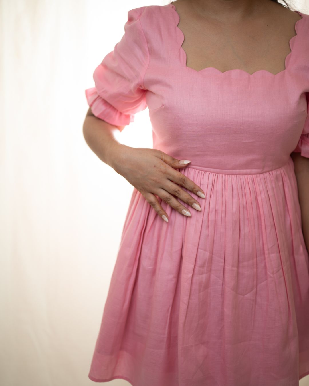 
Soft pink dress with a scallop neckline, fit and flare silhouette, made from breathable cotton. Perfect for casual outings, sunny days, and brunch dates.