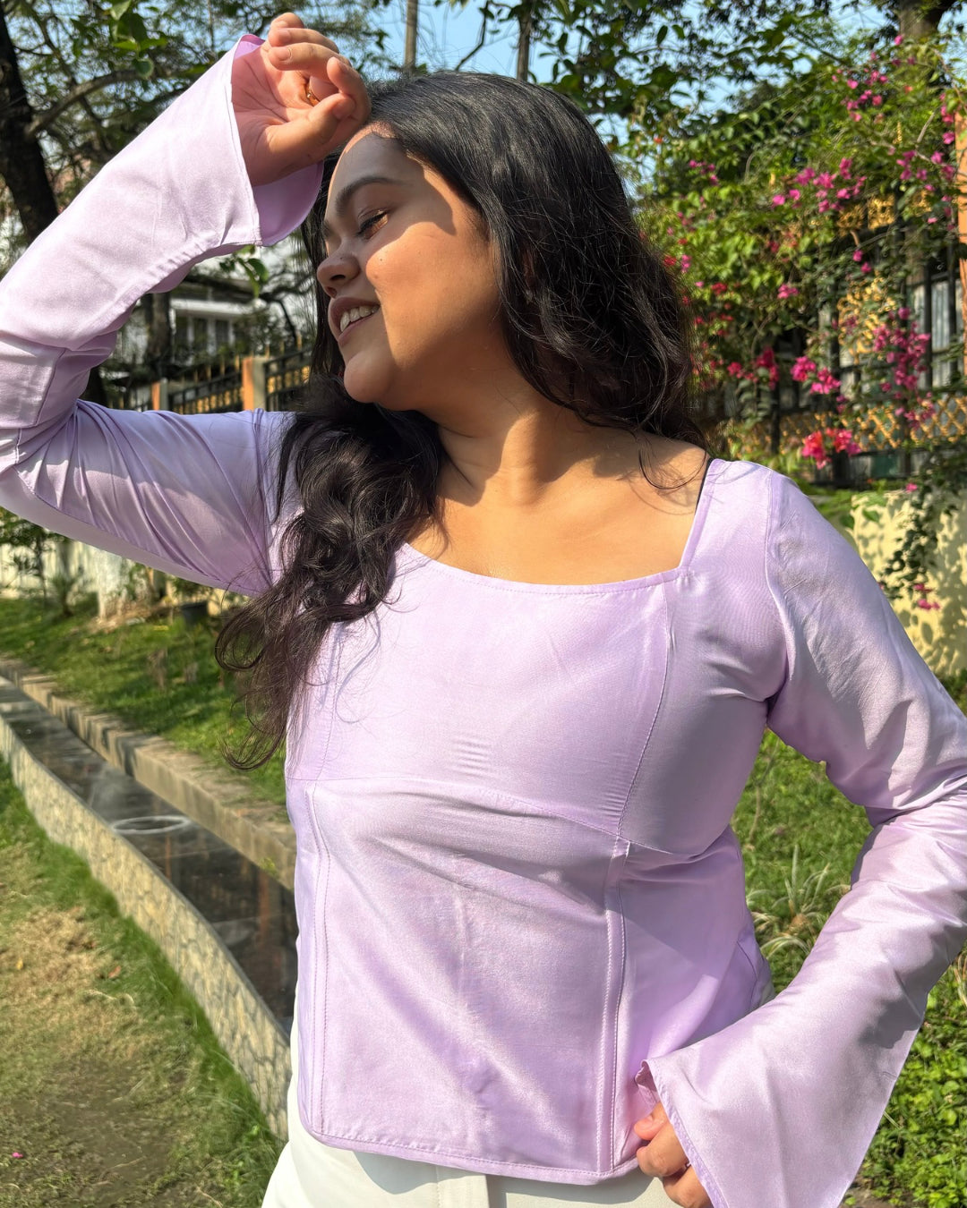 Amethyst Corset Top featuring a scoop neckline, front boning, and tie-up back detail in a rich amethyst hue, crafted from light and airy fabric