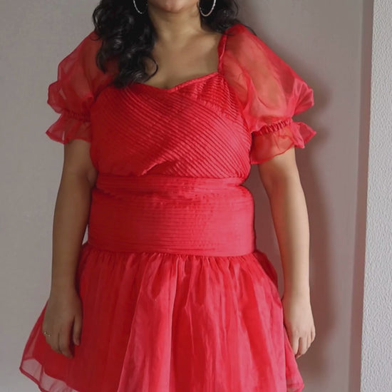 Light pink Blush Dress in airy organza with intricate pleats and refined ruffles, perfect for special events and birthday parties.